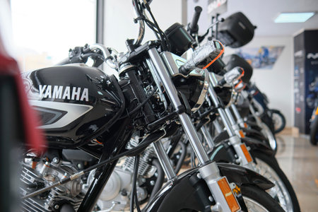 Motorcycles in the showroom Yamaha shop. New motorbikes and accessories in motorcycle store. YB125のeditorial素材