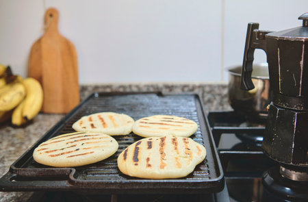 Arepa made from ground corn dough, cornmeal, traditional in the cuisine of Colombia and Venezuela with copy spaceの写真素材