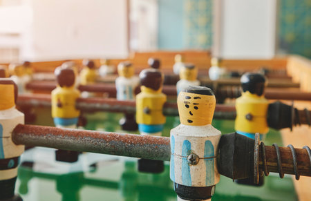 Sport team football players game. Table football for stand. Players miniatures dolls retro games. For sports entertainment and recreation.の写真素材