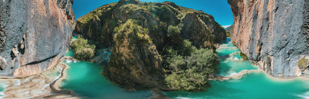 Panoramic view of the turquoise natural pools of Millpu in Huancaraylla. Turquoise lagoons near...