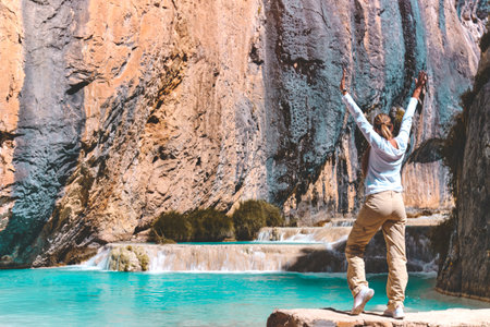 Young woman at viewpoint of the natural pools of Millpu, Ayacucho, Peru. Concept about travelの写真素材