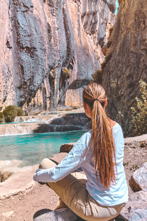 Young woman at viewpoint of the natural pools of Millpu, Ayacucho, Peru. Concept about travelの写真素材