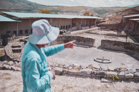 Group of tourists listening the guide explanation about Wari Archaeological Complex, Ayacucho. Peruの写真素材