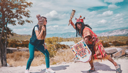 Representation of Inca warrior dressed and with battle, preHispanic fighting with a tourist in Peruの写真素材