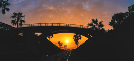 Villena Bridge with traffic and partial City view in the Background sunset, Lima, Peru.
