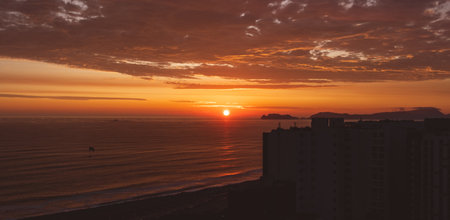 A beautiful and dramatic panoramic photograph of the lima skyline, taken on a golden evening after sunset.の写真素材