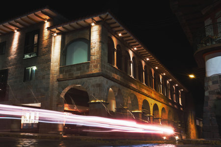Historic Colonial Buildings on the Plaza de Armas Square with Many Visitors at Night, Cusco, Peru, South Americaの写真素材