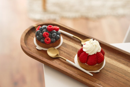 Cake with raspberry and cup of coffee.