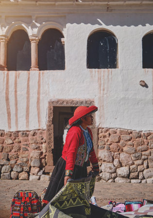 Peruvian woman selling souvenirs at Inca ruins, Sacred Valley, Peruの写真素材