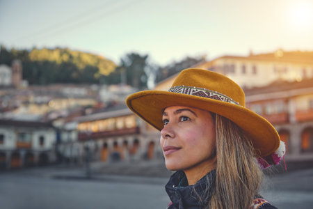 Happy woman sightseeing around Cusco around the Cathedralの写真素材