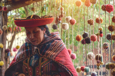 Cuzco, Peru 2022. Andean woman working in traditional Inca wool handicraft production. Traditional pigment material used by the incas.のeditorial素材
