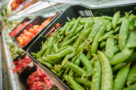 Fruits and vegetables on the shelves at a supermarket close-up. Fresh vegetables and fruits.の写真素材