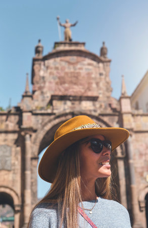 Tourist woman walking with backpack on the street in Cusco, Peru. Copy space