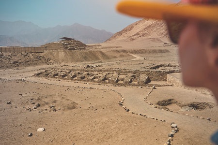 Young Latin woman in archaeological site of the Sacred City of Caral, Peru.の写真素材