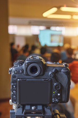 A camera is pointed at a group of peopleの写真素材