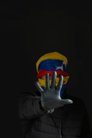 hand as a symbol of stopping dictatorship, resistance for democracy in Venezuela, violation of human rightsの写真素材