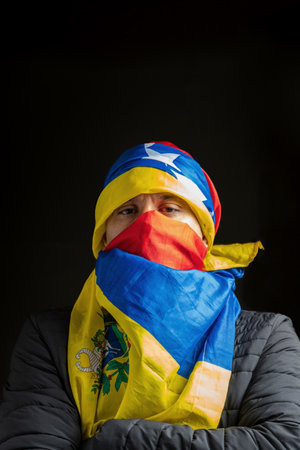 Symbol of repression, hooded fighting for freedom, resistance for democracy in Venezuelaの写真素材