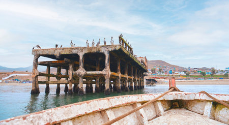 A boat is floating in the water near a pier, Chancay Lima, Peru.の写真素材