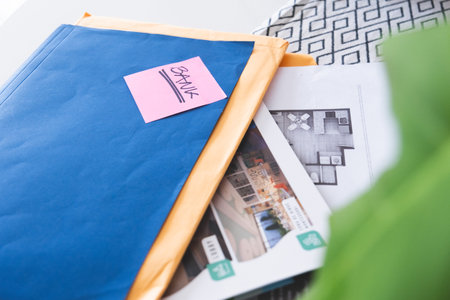A blue envelope with a pink sticker on it