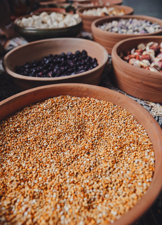 Various dried spices, andean cereals and grains in small bowls and raw herbs. Close up, Grains such as beans.の写真素材