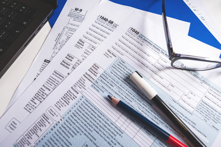 Accountant preparing tax form 1040 for tax season 2025の写真素材