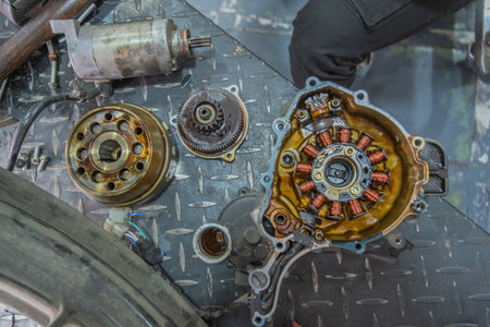 Mechanic checking gearbox in a workshop