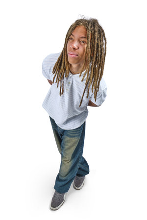 Young man with dreadlocks, hands in pockets, standing on a white backgroundの写真素材
