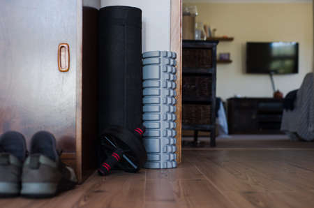 stored workout equipment in living area of a home