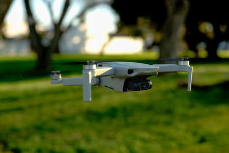 a drone hovering in an open field