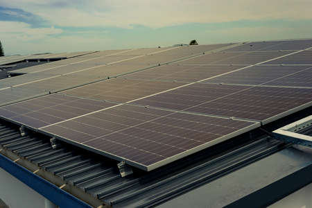 many solar panels on a metal roof