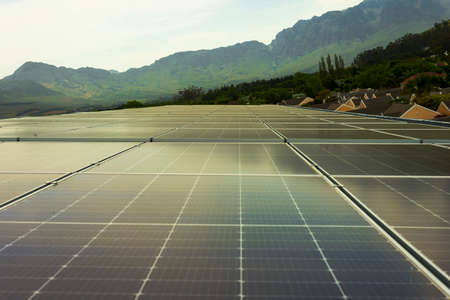 many solar panels on a metal roof