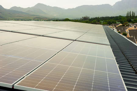 many solar panels on a metal roof