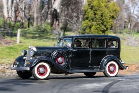 Adelaide, Australia - September 25, 2016: Vintage 1933 Chrysler CT Sedan driving on country roads near the town of Birdwood, South Australia.のeditorial素材