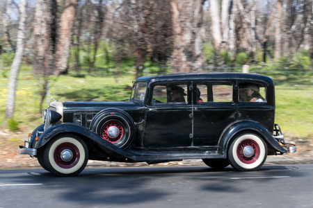 Adelaide, Australia - September 25, 2016: Vintage 1933 Chrysler CT Sedan driving on country roads near the town of Birdwood, South Australia.のeditorial素材
