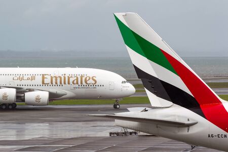 Auckland, New Zealand - April 26, 2011: Emirates Airlines Airbus A380 aircraft taxis past the tail...