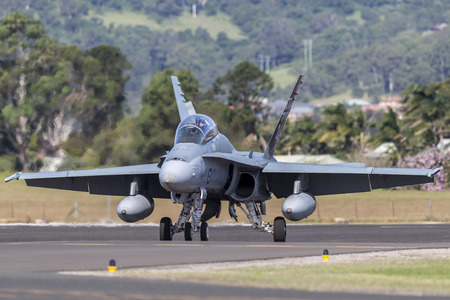 Albion Park, Australia - May 4, 2014: Royal Australian Air Force (RAAF) McDonnell Douglas F/A-18B Hornet jet aircraft A21-110 at Illawarra Regional Airport, Albion Park.のeditorial素材