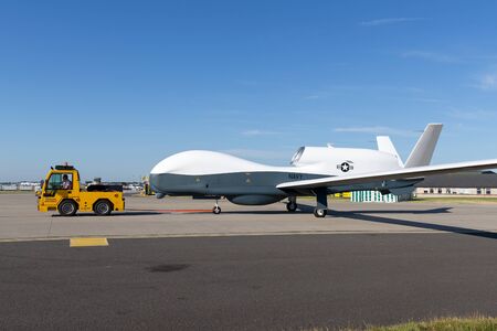 RAF Waddington, Lincolnshire, UK - July 7, 2014: United States Navy Northrop Grumman RQ-4 Global Hawk unmanned surveillance aircraft.のeditorial素材
