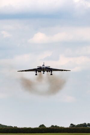 RAF Waddington, Lincolnshire, UK - July 6, 2014: Former Royal Air Force (RAF) Avro Vulcan B.2 bomber aircraft XH558 operated by the Vulcan to the Sky trust at the 2014 RAF Waddington Airshow.のeditorial素材