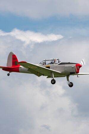 RAF Waddington, Lincolnshire, UK - July 4, 2014: Former Portuguese Air Force de Havilland DHC-1 Chipmunk T.20 G-DHPM on approach to land.のeditorial素材