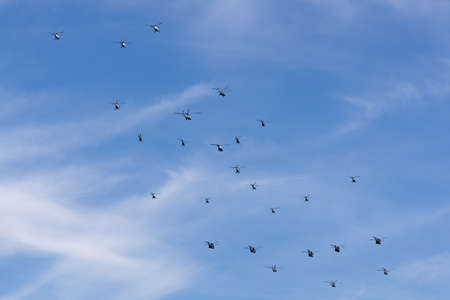 Sydney, Australia - October 5, 2013: Mass formation of 26 Australian Military helicopters flying...