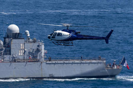 Sydney, Australia - October 11, 2013: Eurocopter AS 350B3 Helicopter VH-XGC conducting aerial filming over Sydney Harbour.のeditorial素材