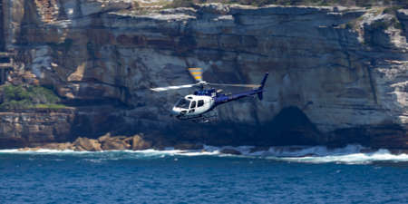Sydney, Australia - October 11, 2013: Eurocopter AS 350B3 Helicopter VH-XGC conducting aerial...