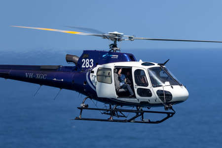 Sydney, Australia - October 11, 2013: Eurocopter AS 350B3 Helicopter VH-XGC conducting aerial...