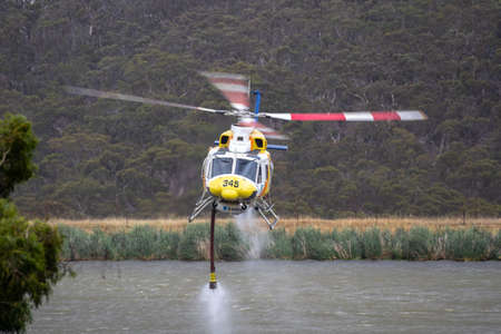 Bundoora, Australia - December 30, 2019:Bell 412 helicopter taking off after filling with a load of...