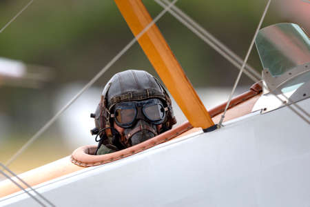 RAAF Williams, Point Cook, Australia - March 1, 2014: Pilot wearing vintage flying helmet and goggles int he cockpit of a vintage Sopwith Pup biplane operated by the RAAF Museum.のeditorial素材