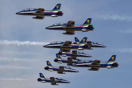 RAF Fairford, Gloucestershire, UK - July 12, 2014: Frecce Tricolori formation display team of the Italian Air Force (Aeronautica Militare Italiana) flying Aermacchi MB-339PAN aircraft.のeditorial素材
