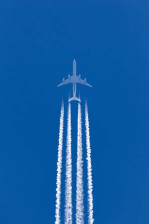 RAF Fairford, Gloucestershire, UK - July 10, 2014: Lufthansa Airbus A340 large airliner flying at high altitude with a large contrail behind it.のeditorial素材