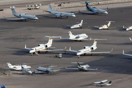 Las Vegas, Nevada, USA - May 5, 2013: Overview of the private jet ramp at McCarran International Airport Las Vegas with multiple luxury jets parked on the tarmac.のeditorial素材