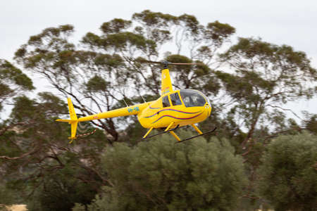 Rowland Flat, Australia - April 14, 2013: Robinson R-44 Raven II helicopter operated by Barossa...