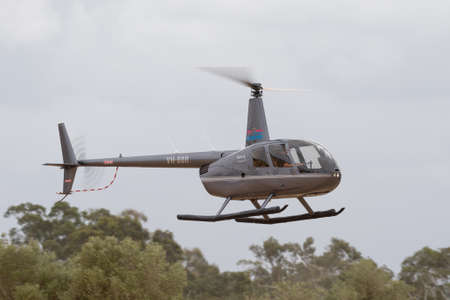 Rowland Flat, Australia - April 14, 2013: Robinson R-44 Raven II helicopter VH-BBR operated by...